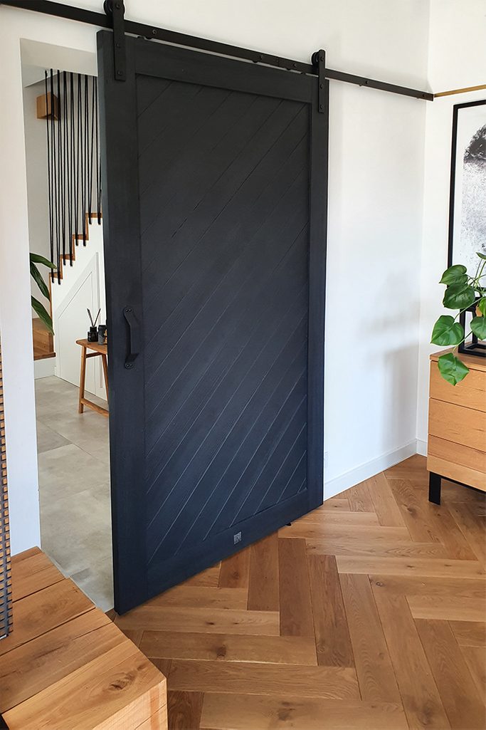 Black Wooden Sliding Door In The Living Room Reno Doors