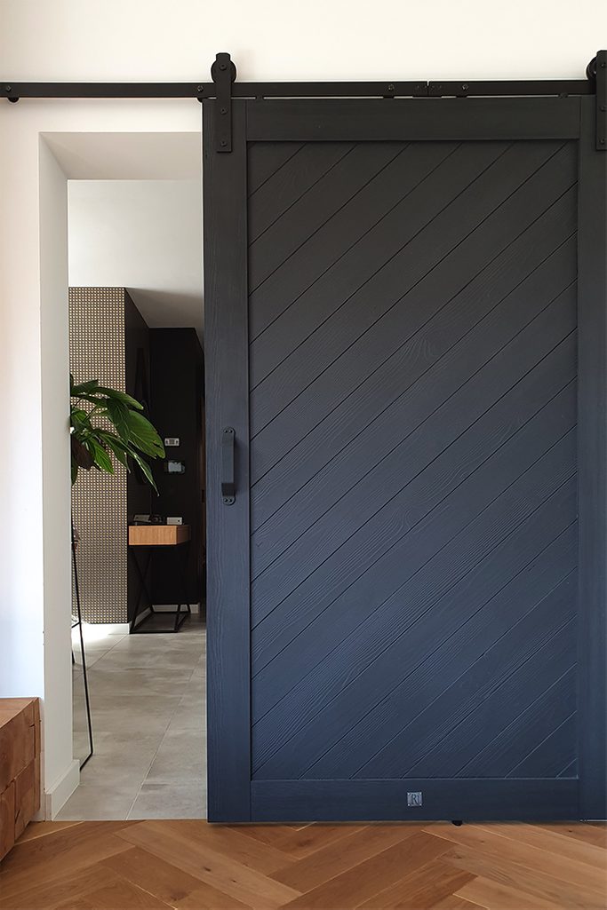 Black Wooden Sliding Door In The Living Room Reno Doors