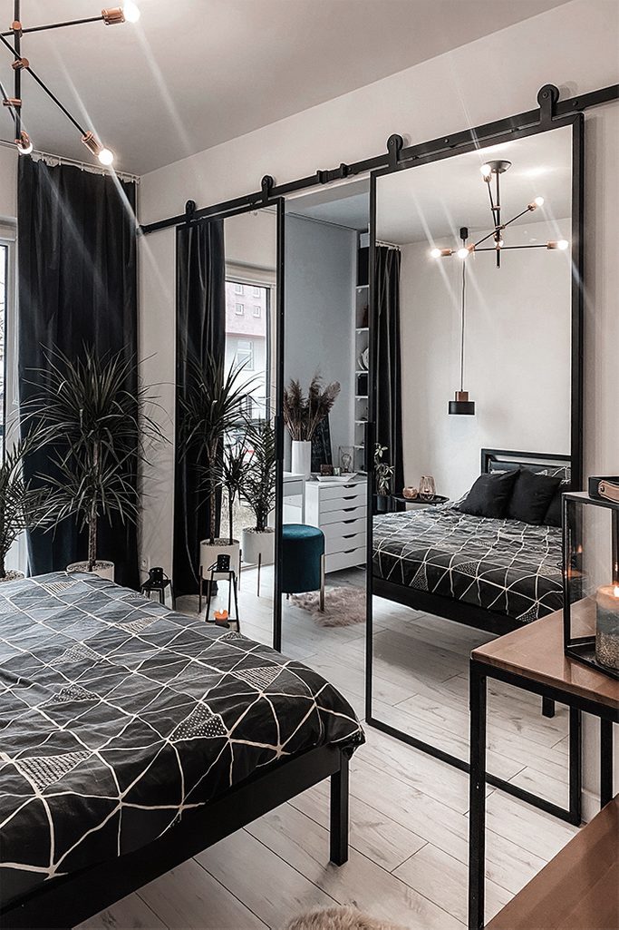 Double Sliding Door With Mirror In A Modern Bedroom Reno Doors Double Sliding Door With Mirror In A, Black Framed Mirror Sliding Wardrobe Doors