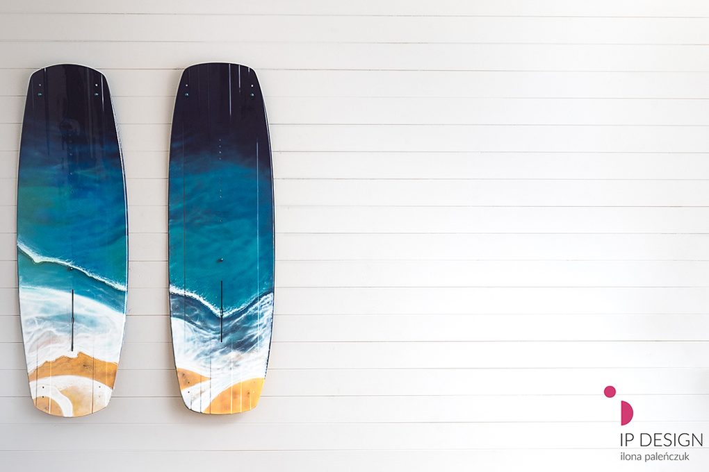 blue decorative surfboard with maritime theme