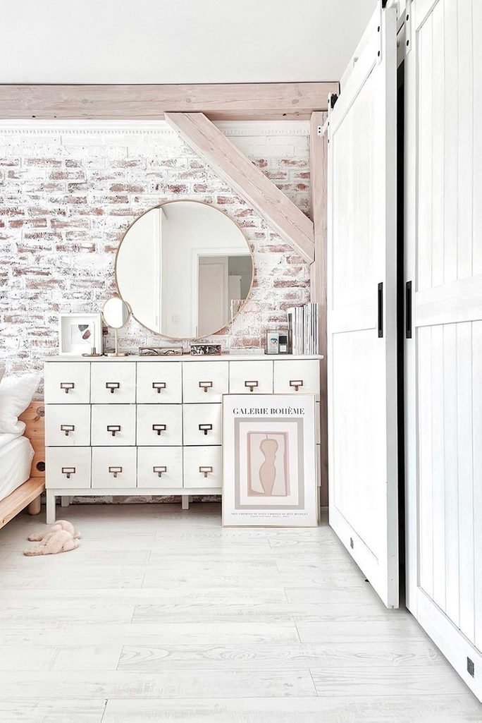 white bedroom design, brick on the wall in the bedroom, brick wall painted in white, rustic bedroom, white chest of drawers in bedroom, bedroom with an alcove